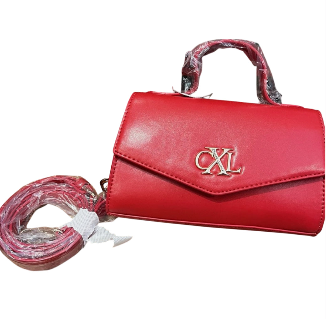 CXL by Christian Lacroix Laine Matte Patent Crossbody Bag in red.
