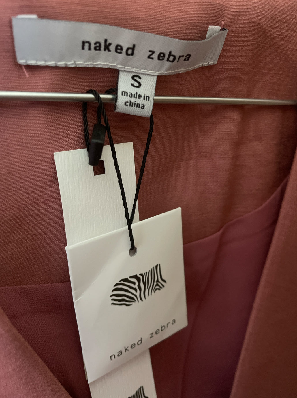 Naked Zebra pink sleeveless blazer vest with a single button closure.(Small)