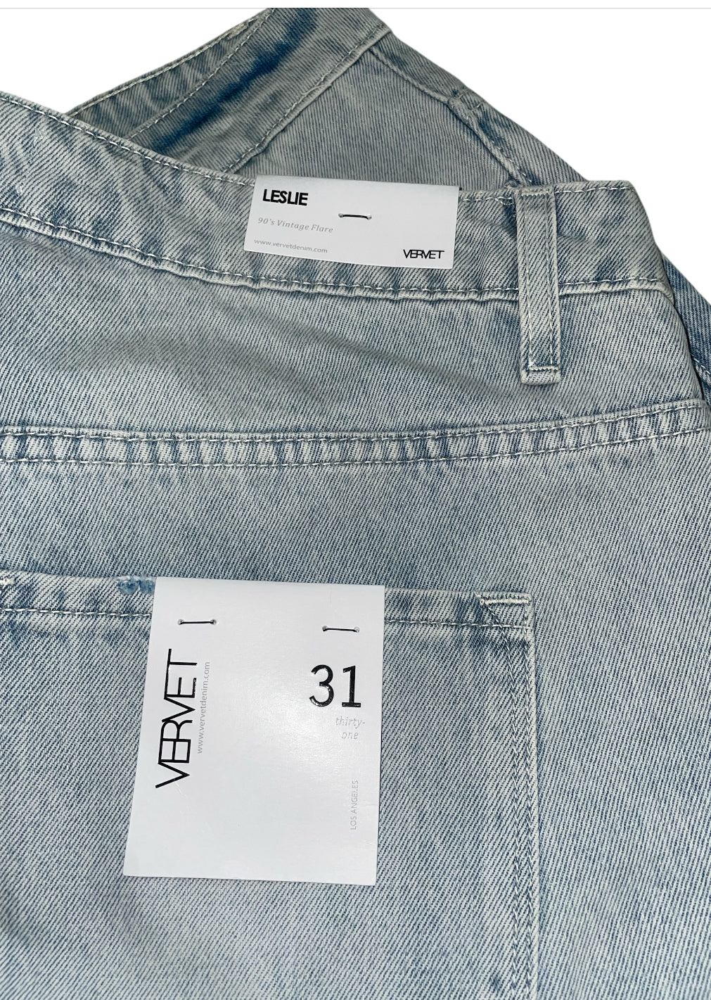 Vervet Leslie light wash distressed flare jeans.(31)
