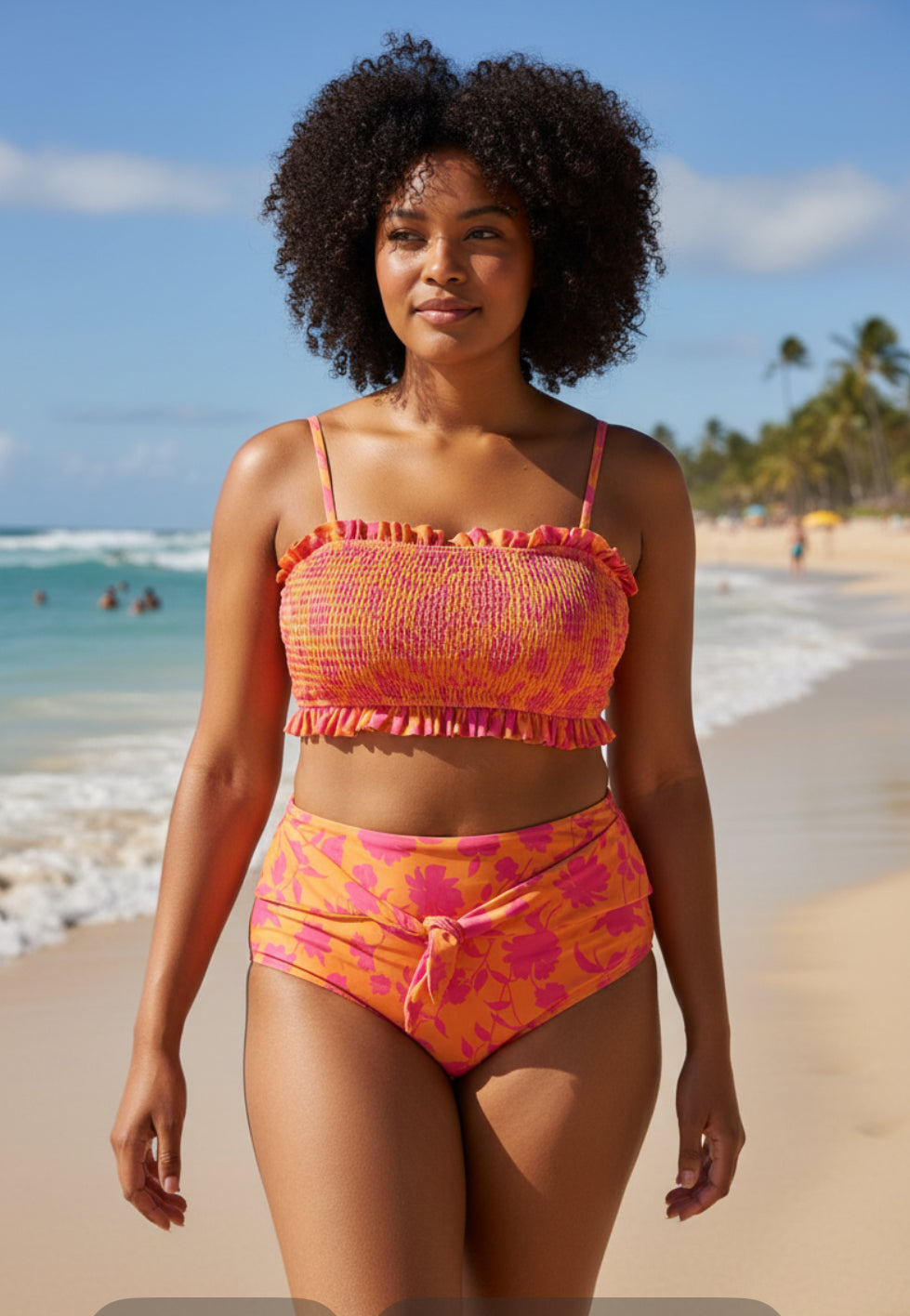 AndTheWhy smocked bikini set with a vibrant orange and hot pink floral pattern (1x)